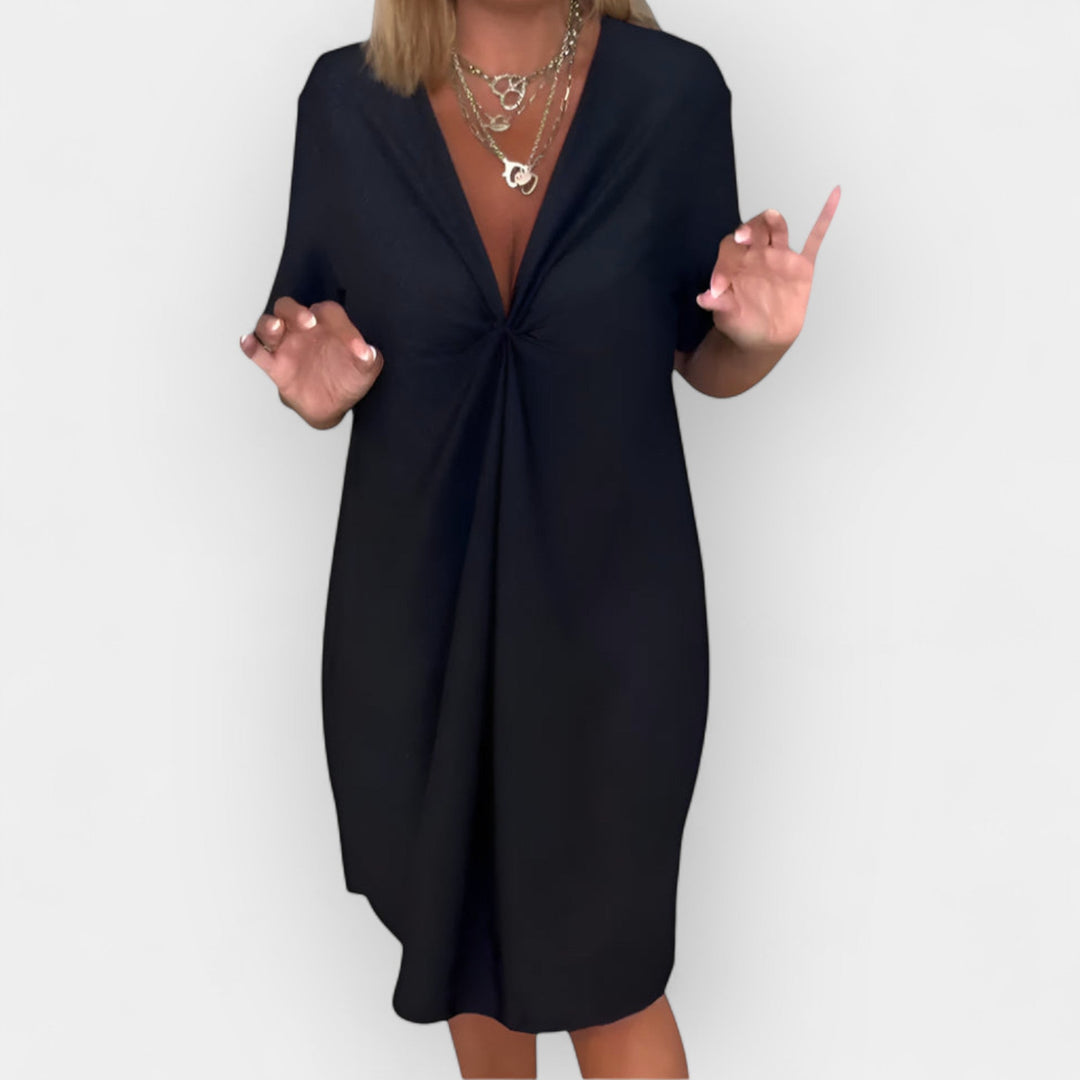 Tyylikäs mekko | V-pääntiellä ja koristeellisella helmalla